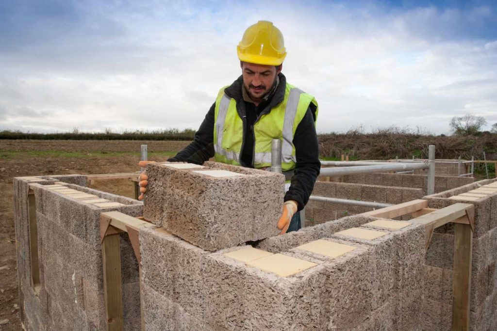 Man building with Durisol UK ICF units. Benefits of woodcrete ICF